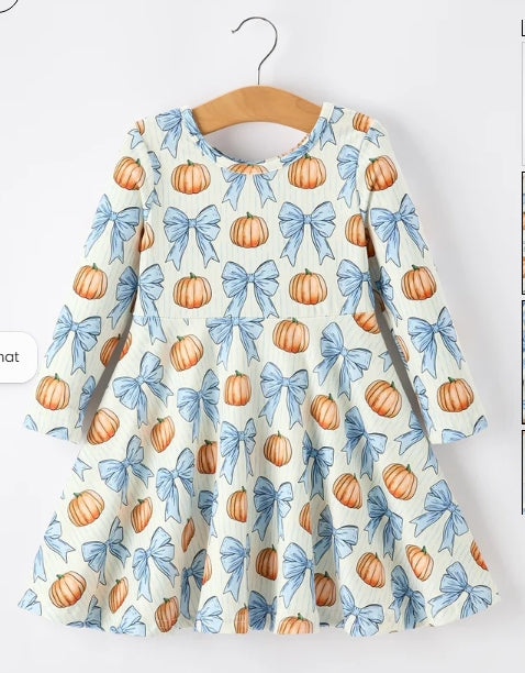 Back of Pumpkin and Blue Bow girls dress with long sleeves and flared skirt.