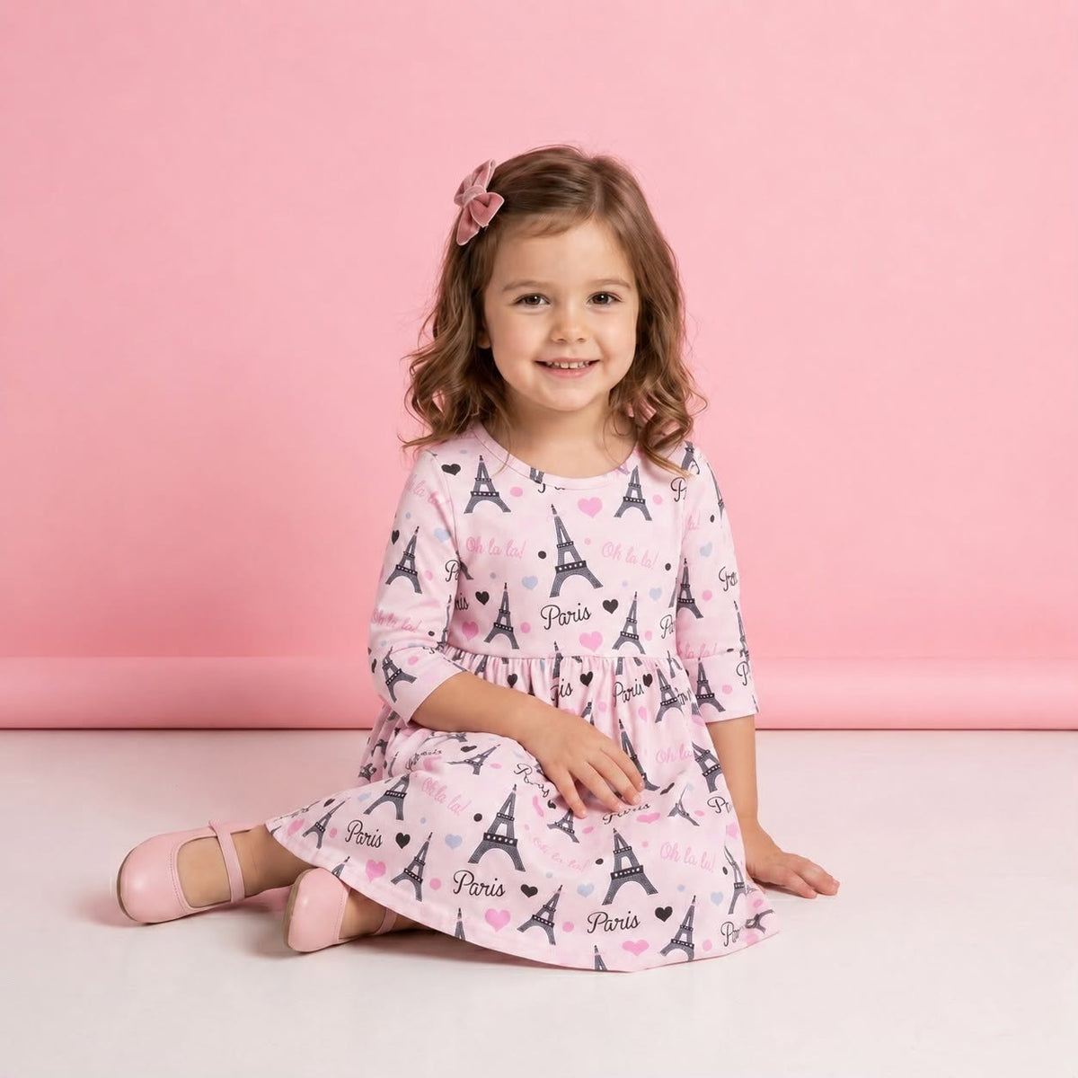 Paris Oh La La! Girl Dress - model wearing pink Eiffel Tower print 3/4 sleeve dress