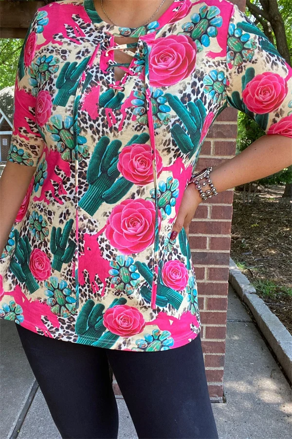 Front detail of pink rose and green cactus top with leopard-print accents and crisscross neckline ties.