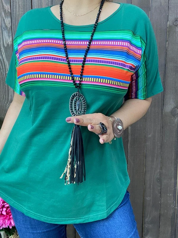 Front view of green women's top with orange blue pink and purple stripe details