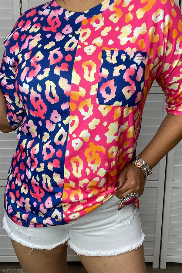 Women's navy and hot-pink half-and-half leopard print short sleeve top with contrasting navy chest pocket