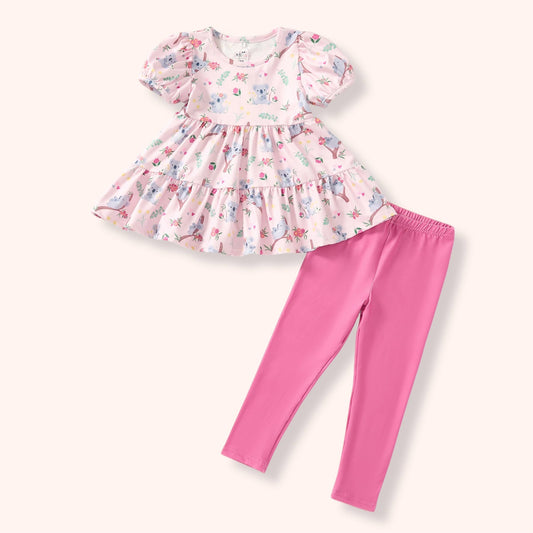 Koala Cuddles two-piece set with pale pink koala and floral print tiered top and bright pink pants.