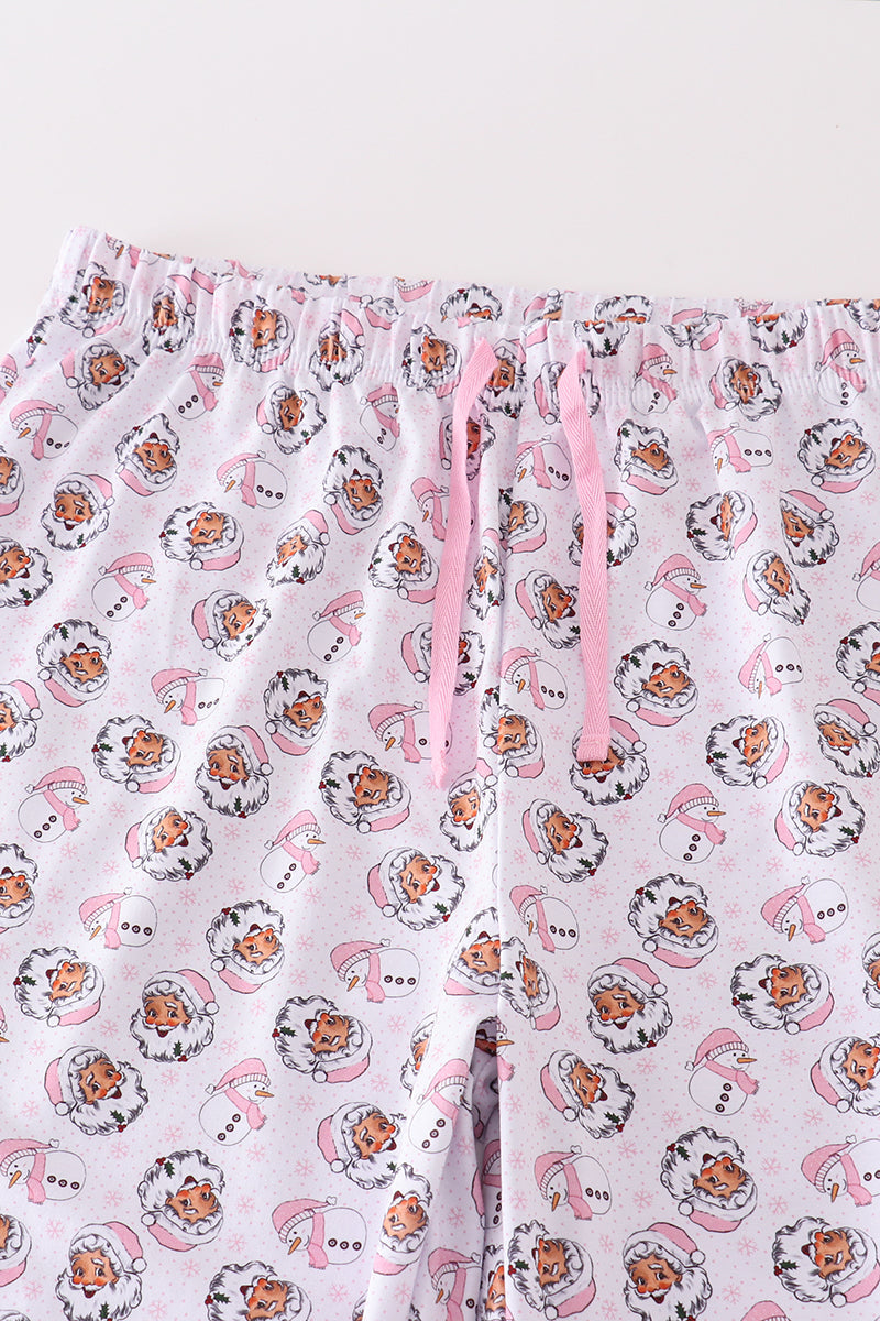 Close-up of the elastic waistband and pink drawstring on the Santa print pajama pants
