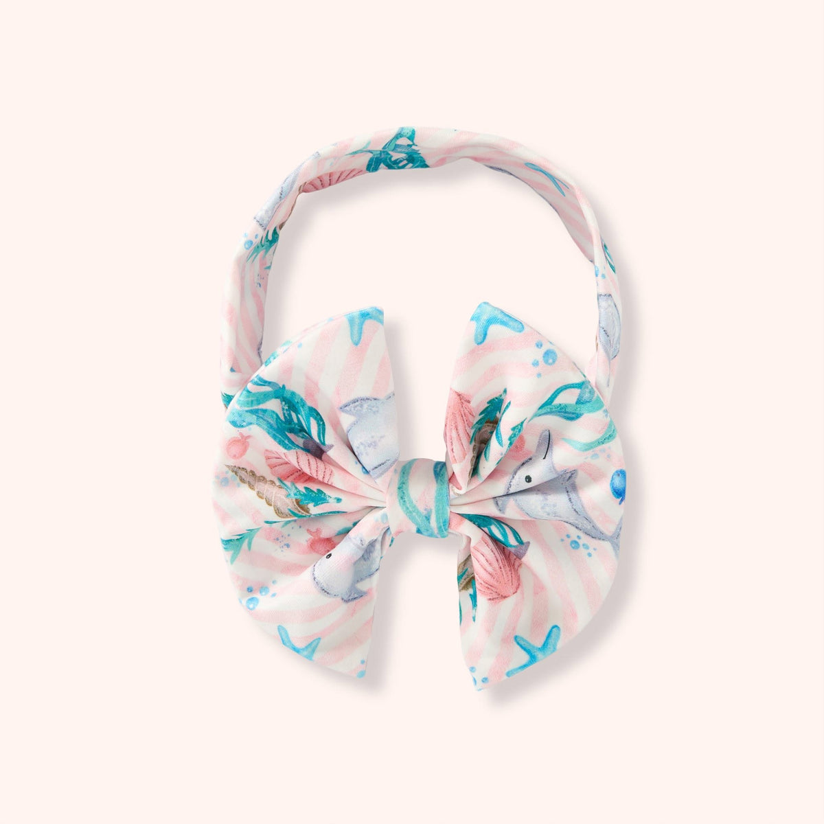 Children’s bow headband in the Dolphin Dreams print