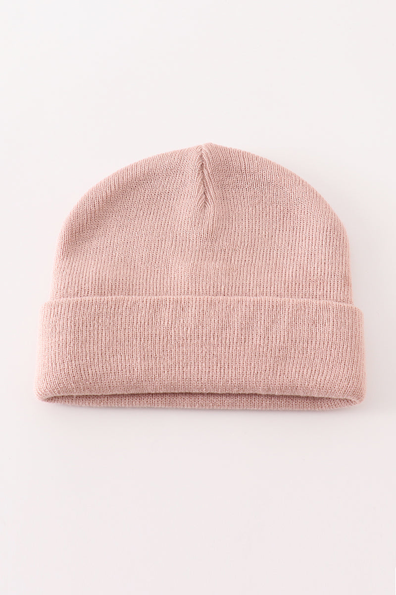 Pink ribbed knit beanie hat with a fold-over cuff