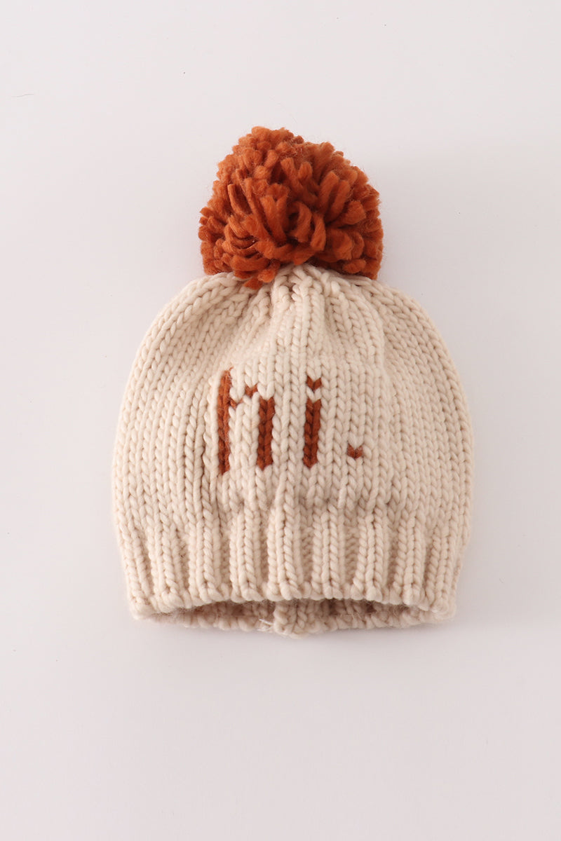Beige cable-knit pompom beanie with rust-colored Hi detail for Infant and Kids