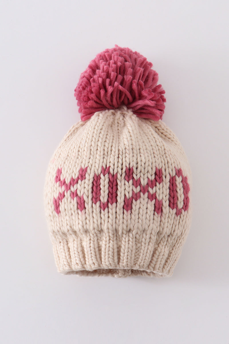Cream knit beanie with a pink pompom and pink XOXO detail for infants