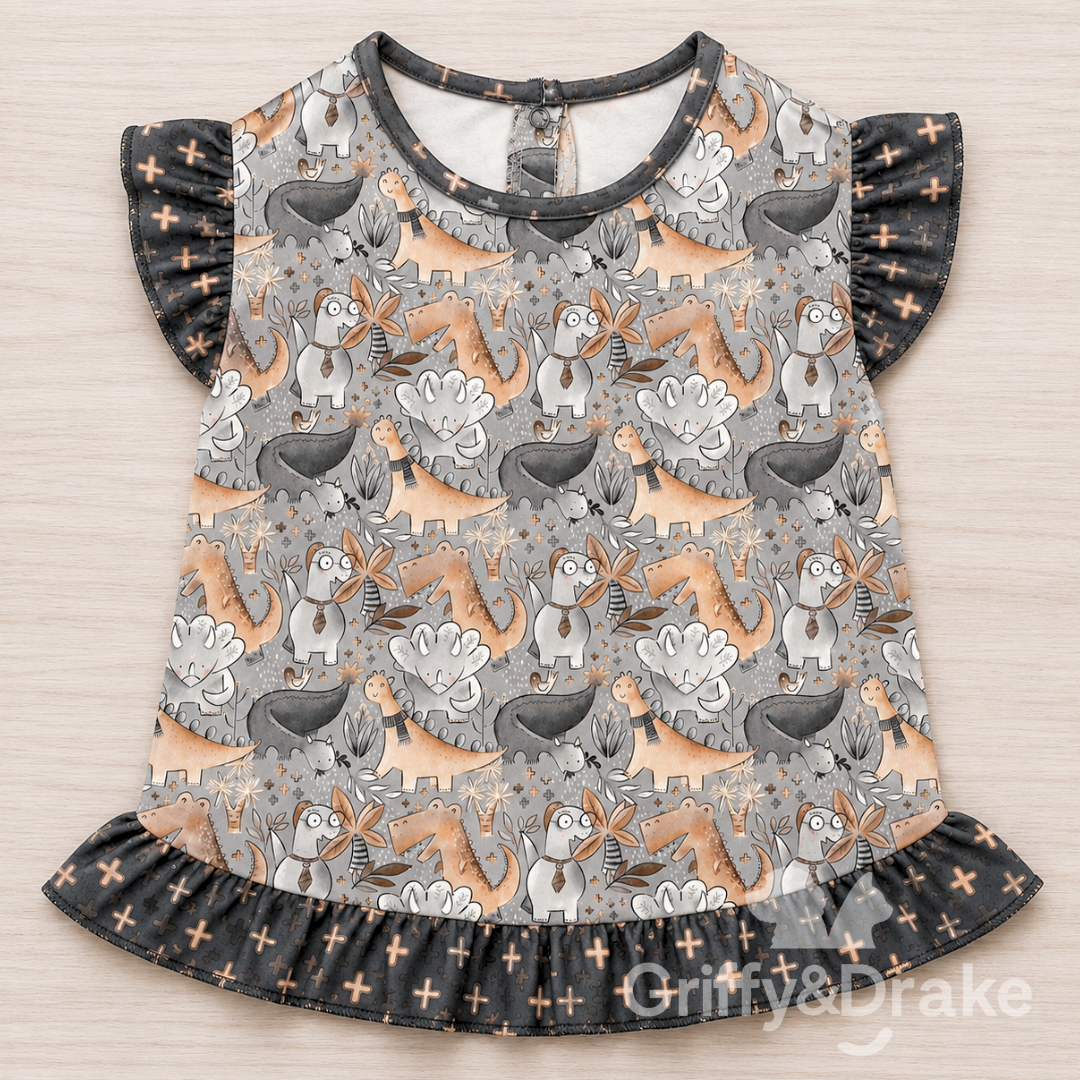 Jurassic Tails Ruffle Shirt by Griffy & Drake - whimsical dinosaur print with dark ruffle trim