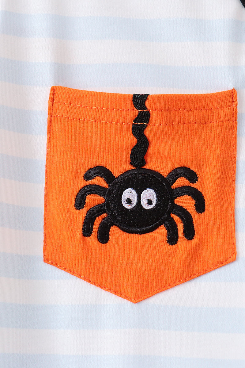 Close-up of embroidered spider pocket detail