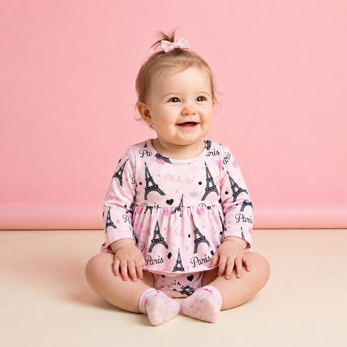 Paris Oh La La! Girl Infant Romper - baby model wearing pink Eiffel Tower print skirted bubble romper