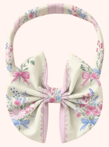 Children’s bow headband with a soft pastel floral print