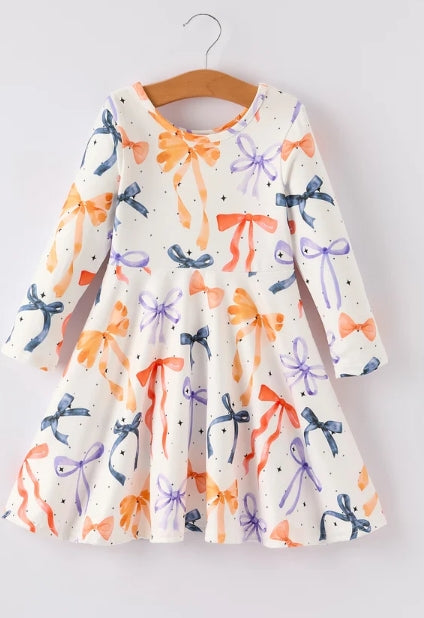 Front of long-sleeve Halloween Bow girls dress with orange, lavender, and dark bows on a light background.