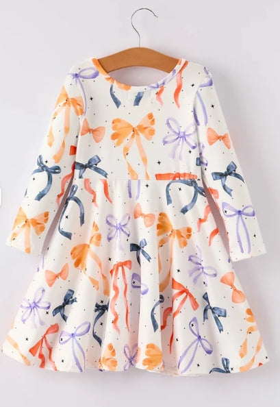 Back of Halloween Bow girls dress with colorful bow print and gathered skirt.