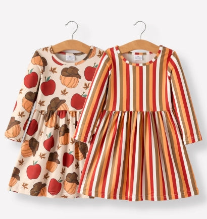 Front of Thanksgiving two-dress set with autumn apple and pumpkin motifs and warm vertical stripes.