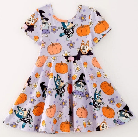 Back of lavender cartoon pumpkin-print girls dress with short sleeves and flared skirt.