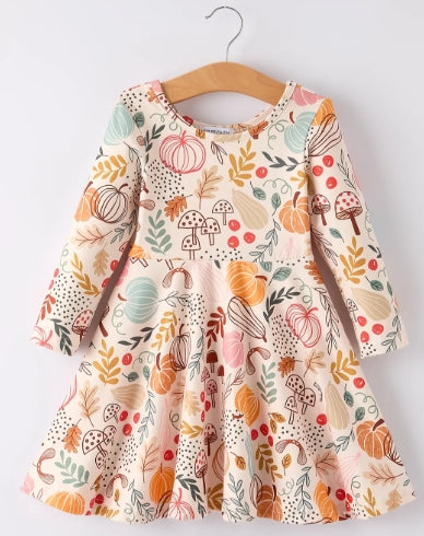 Back of fall pumpkin leaf print girls dress with gathered skirt.