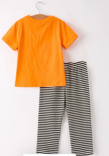 Back view of orange Halloween boys shirt with black-and-white striped pants