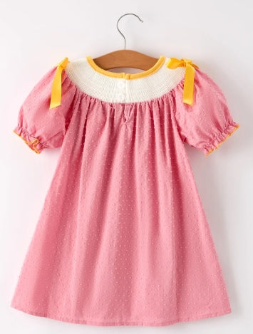 Back view of pink Thanksgiving girls dress with yellow bows