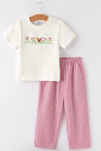 Cream boys shirt with rooster smock embroidery and red-and-white striped pants