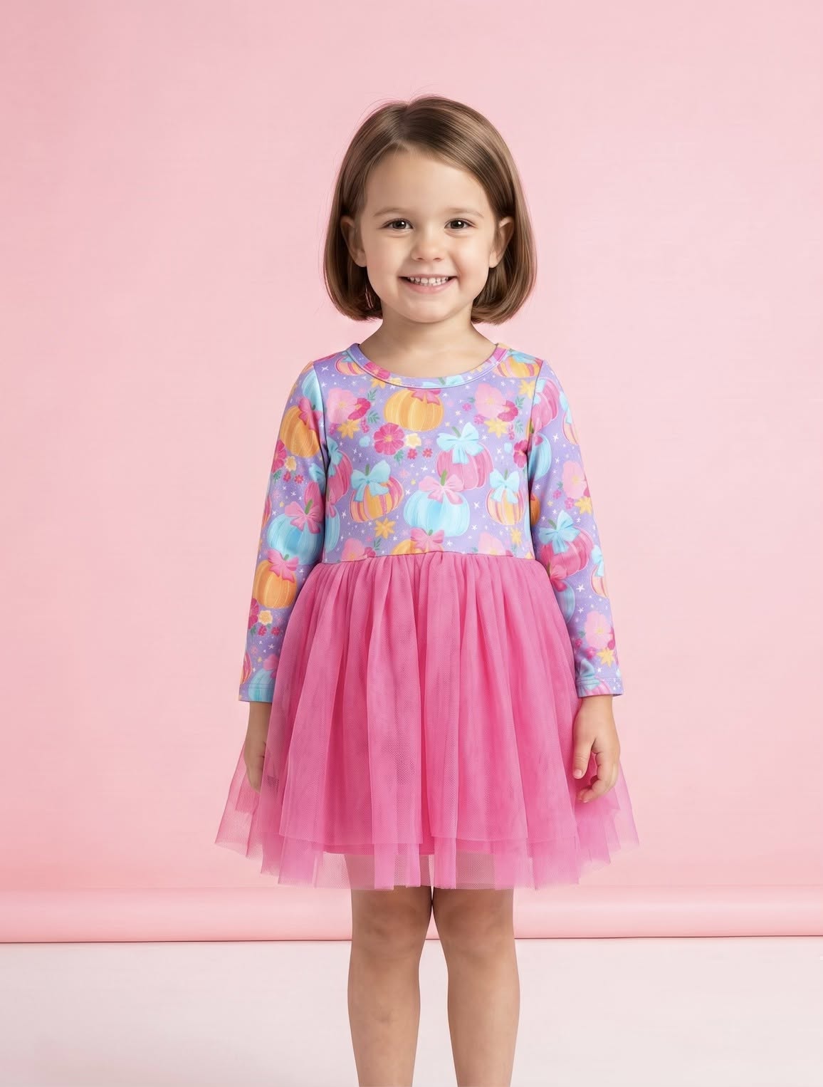 Preppy Pumpkins Dress by Pete + Lucy - model wearing lavender pumpkin print bodice with hot pink tulle skirt