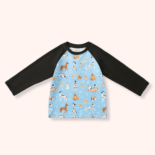 Playful Paws Boy Shirt flat lay - light blue dog print raglan tee with black sleeves