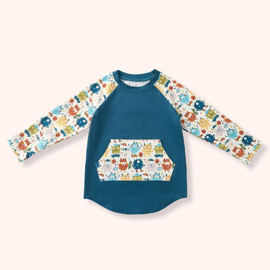 Monster Crew raglan shirt with teal body, monster print sleeves and kangaroo pocket