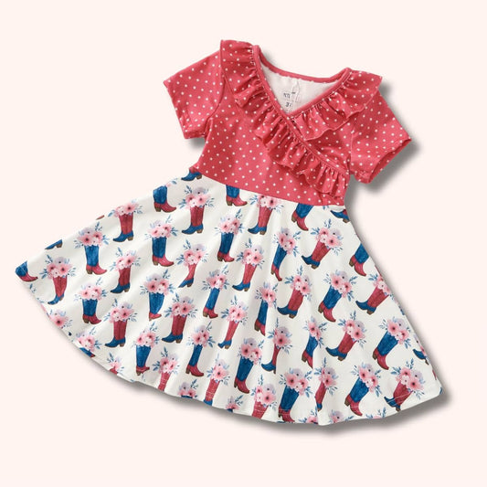 Boots and Blooms Girl Dress flat lay - pink star bodice with cowboy boots floral skirt