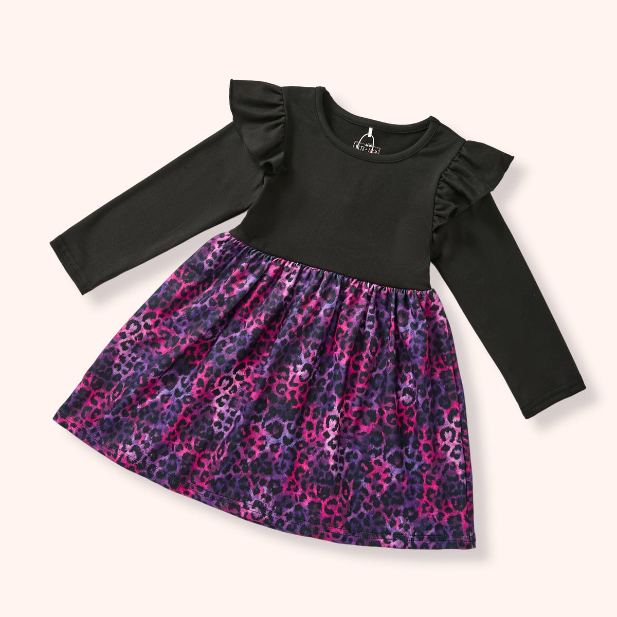 Jungle Glam dress with black ruffle-shoulder bodice and animal-print skirt