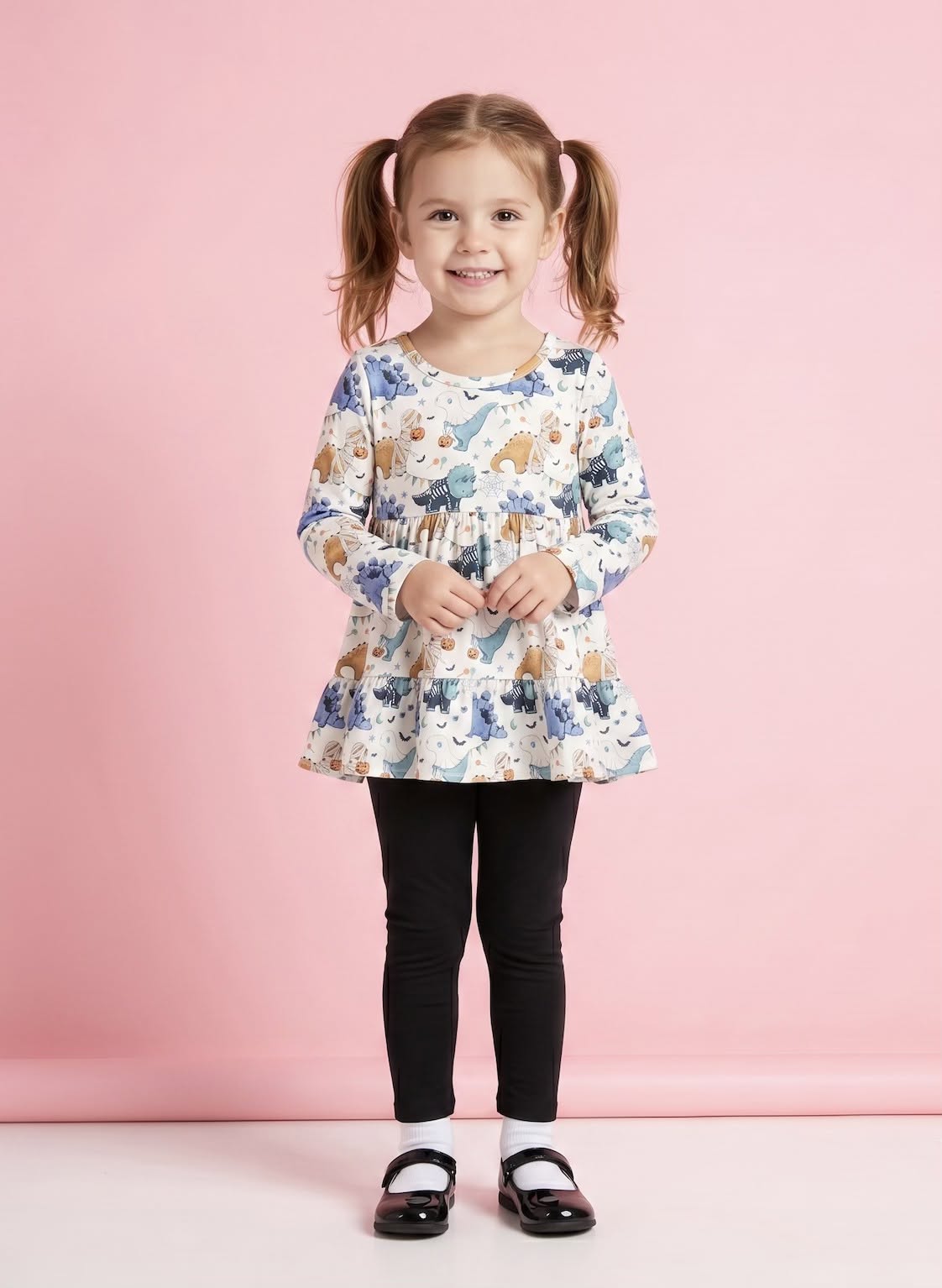 Trick-or-Saurus 2 Piece Set on model - girl wearing Halloween dinosaur print ruffle top with black leggings