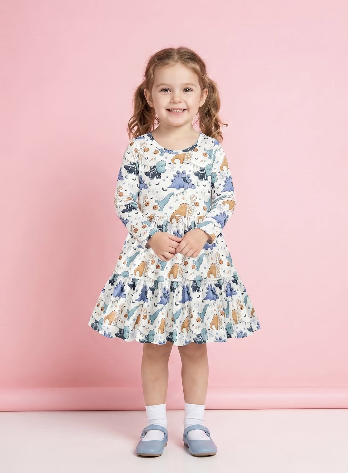 Trick-or-Saurus Dress on model - girl wearing Halloween dino print tiered ruffle dress