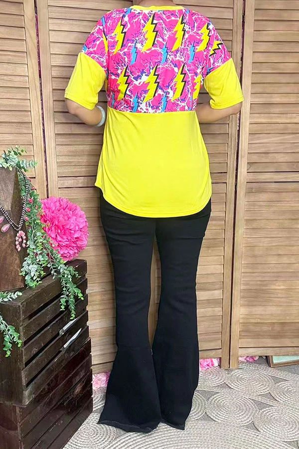 Back view of women's yellow top with yellow and turquoise lightning bolts on a pink upper panel.