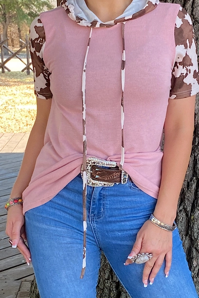 Front detail of pink Western Baby top with cow-print hood and drawstrings
