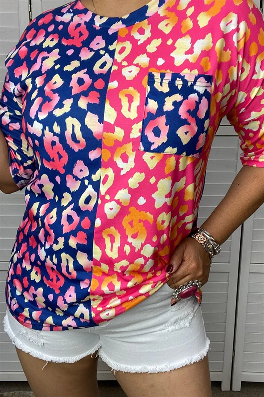 Women's navy and hot-pink half-and-half leopard print short sleeve top with contrasting navy chest pocket