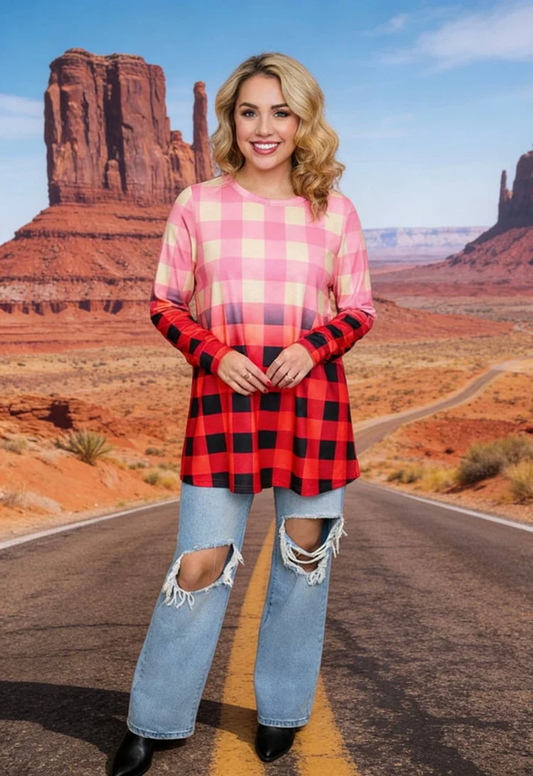 Woman modeling a long-sleeve top fading from pink and cream checks to red-and-black buffalo plaid.