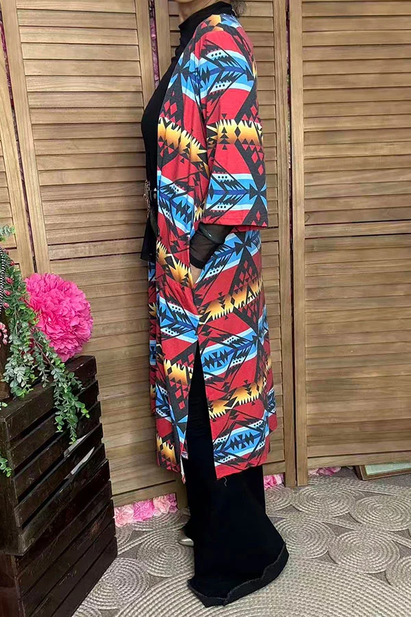 Side view of women's longline geometric print cardigan.