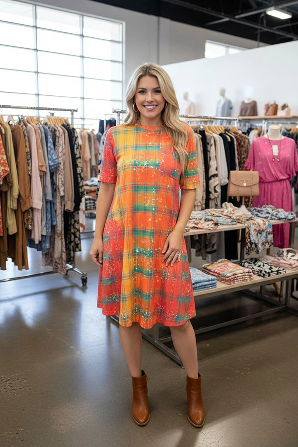 Women's western checked print dress styled with brown boots