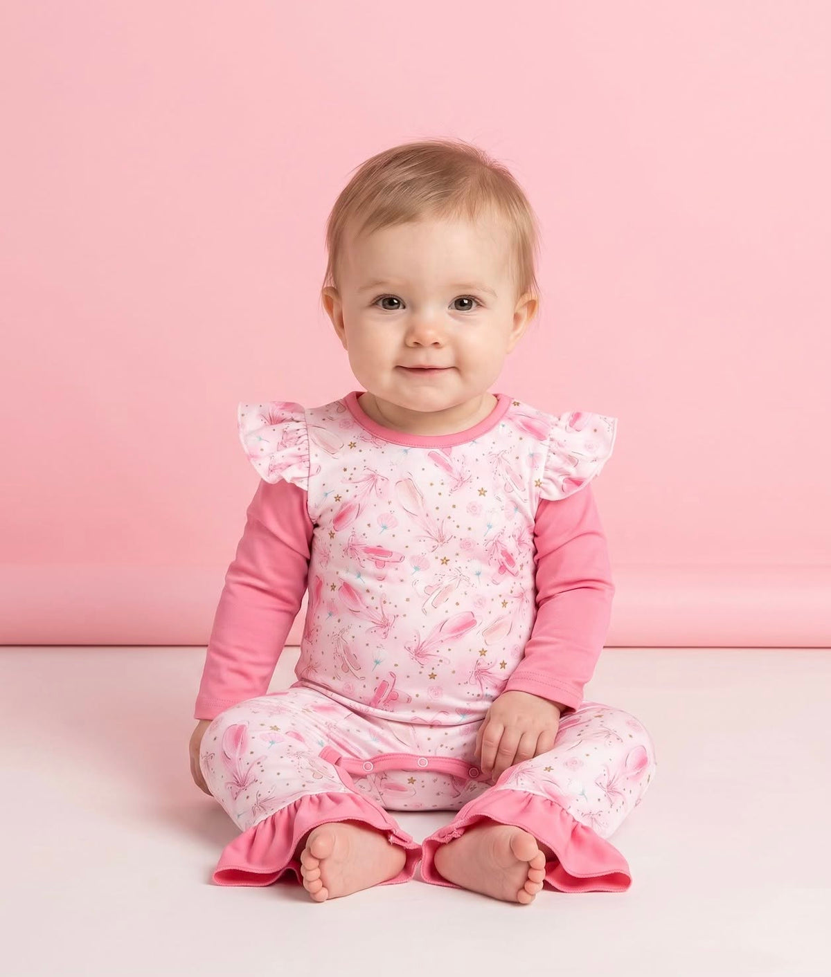 Baby wearing the Prima Ballerina pink infant romper