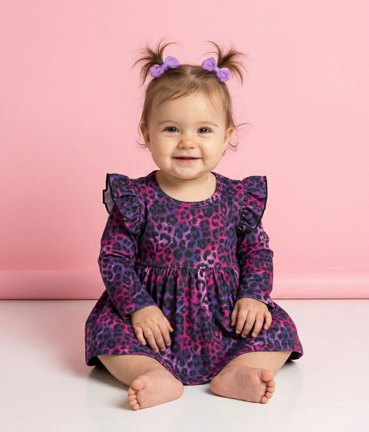 Baby wearing the Jungle Glam infant romper