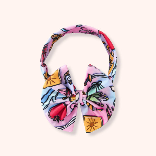 Children’s bow headband in the Princess Mash Up print