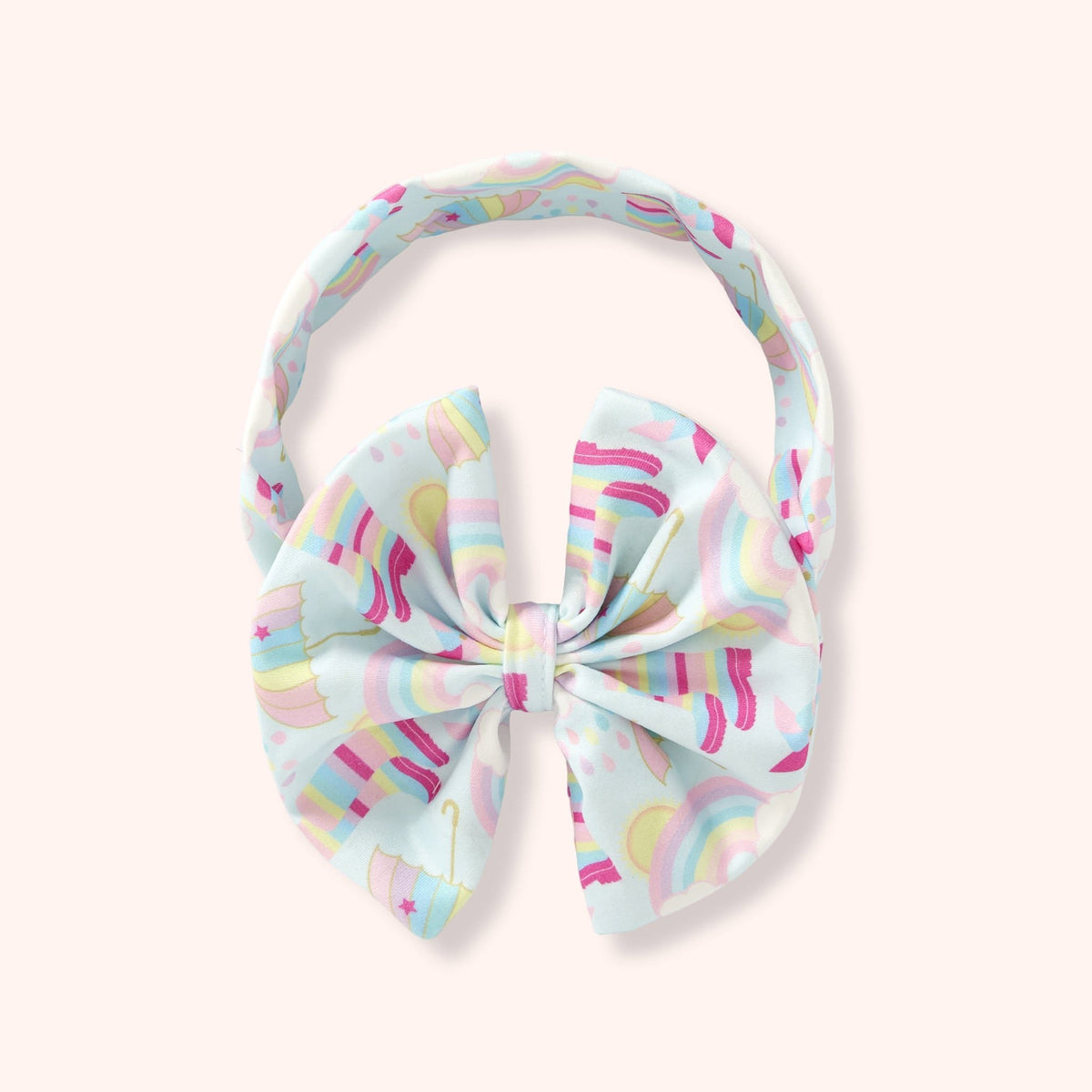 Children’s bow headband in the Rainbow Showers print