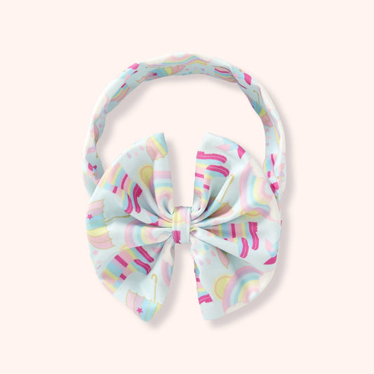 Children’s bow headband in the Rainbow Showers print