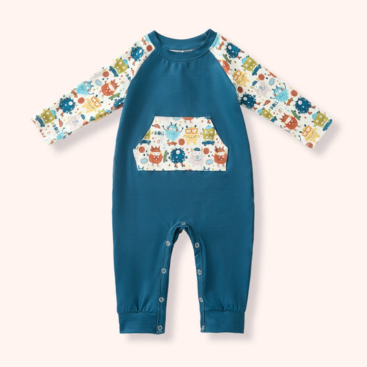 Monster Crew infant romper with teal body, monster print sleeves and kangaroo pocket