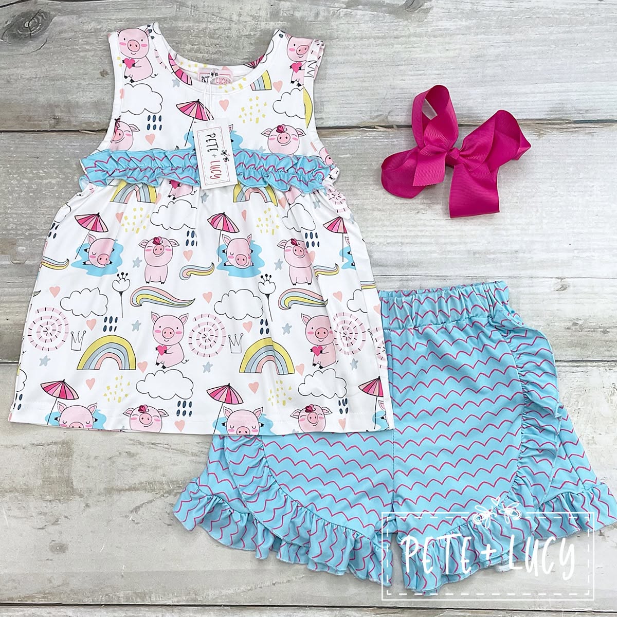 Pete + Lucy Piggy Party short set with pig-print top and blue ruffled shorts