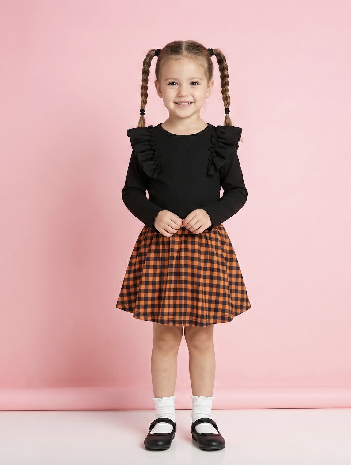 Child wearing the Harvest Gingham black top and skort set