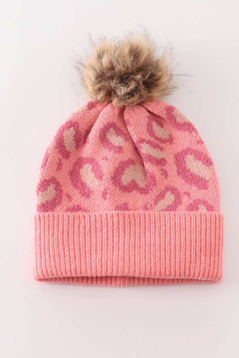 Pink leopard-pattern knit beanie with a fluffy pompom